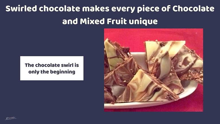 An image of Chocolate and Mixed Fruit Triangles with biscuit pieces and studded with dried fruit