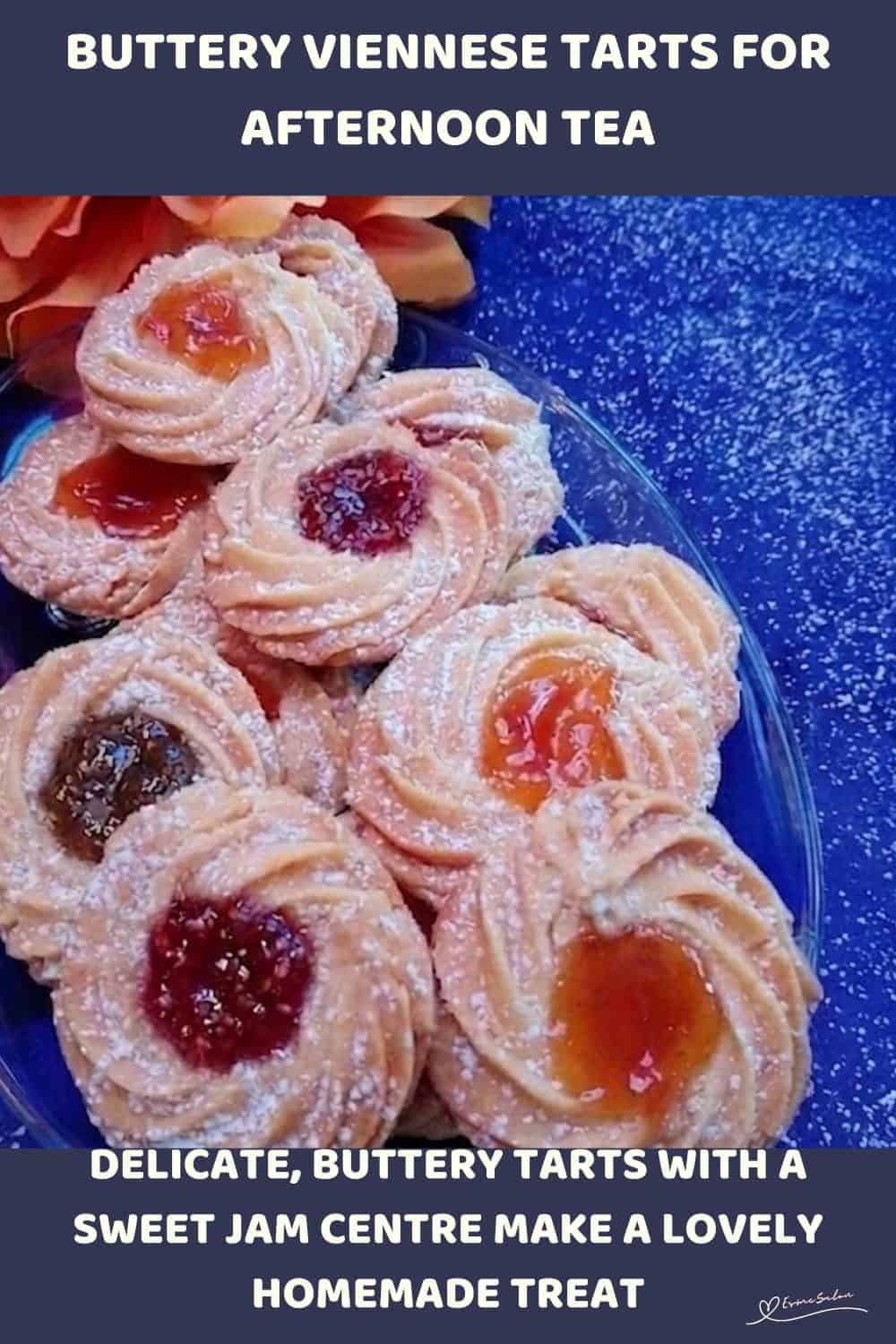 An image of Buttery Viennese Tarts, with jam centers and a dusting of icing sugar