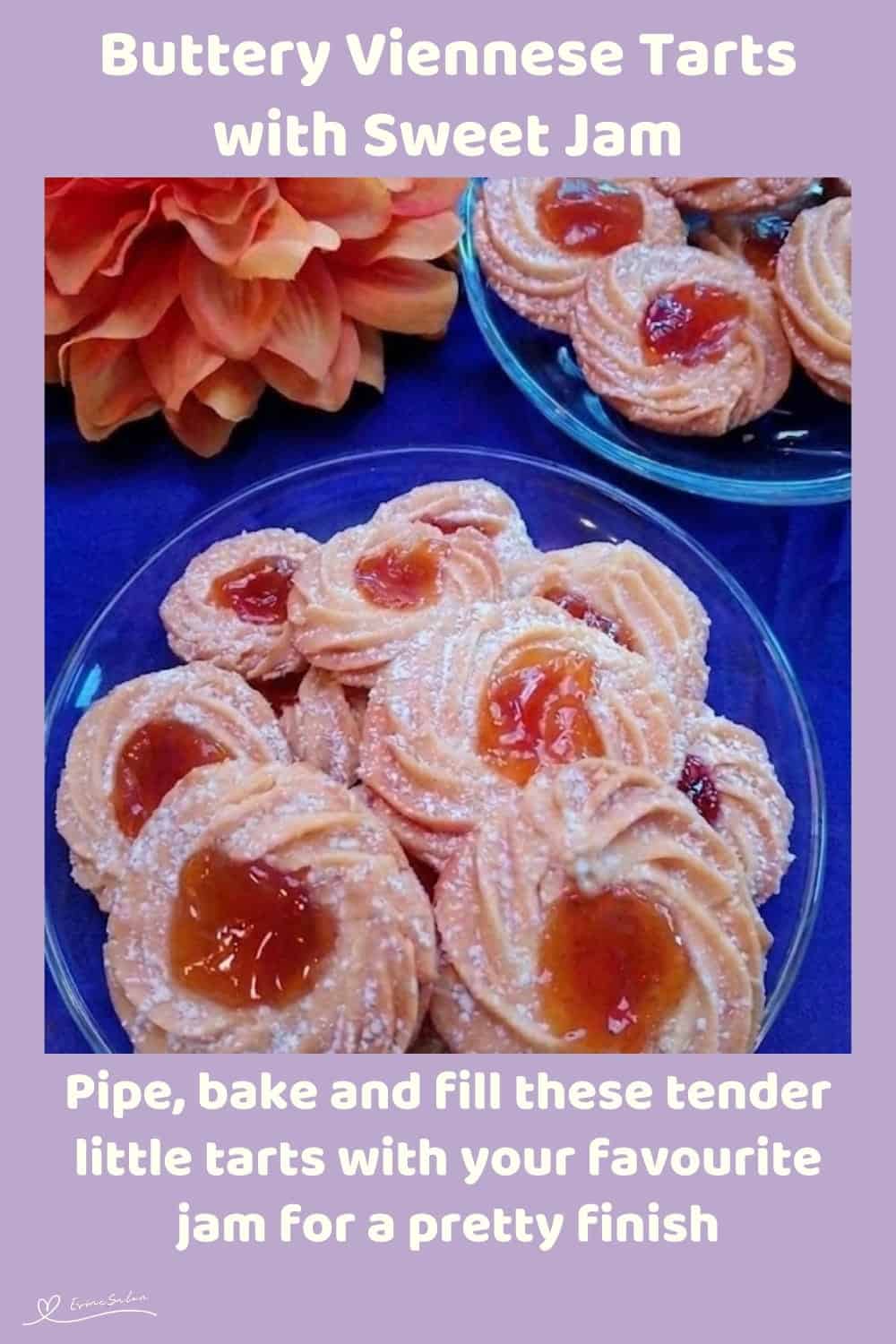 An image of Buttery Viennese Tarts, with jam centers and a dusting of icing sugar