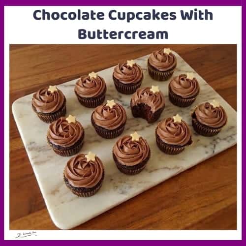 An image of a box and platter with Chocolate Cupcakes With Rich Cocoa Buttercream