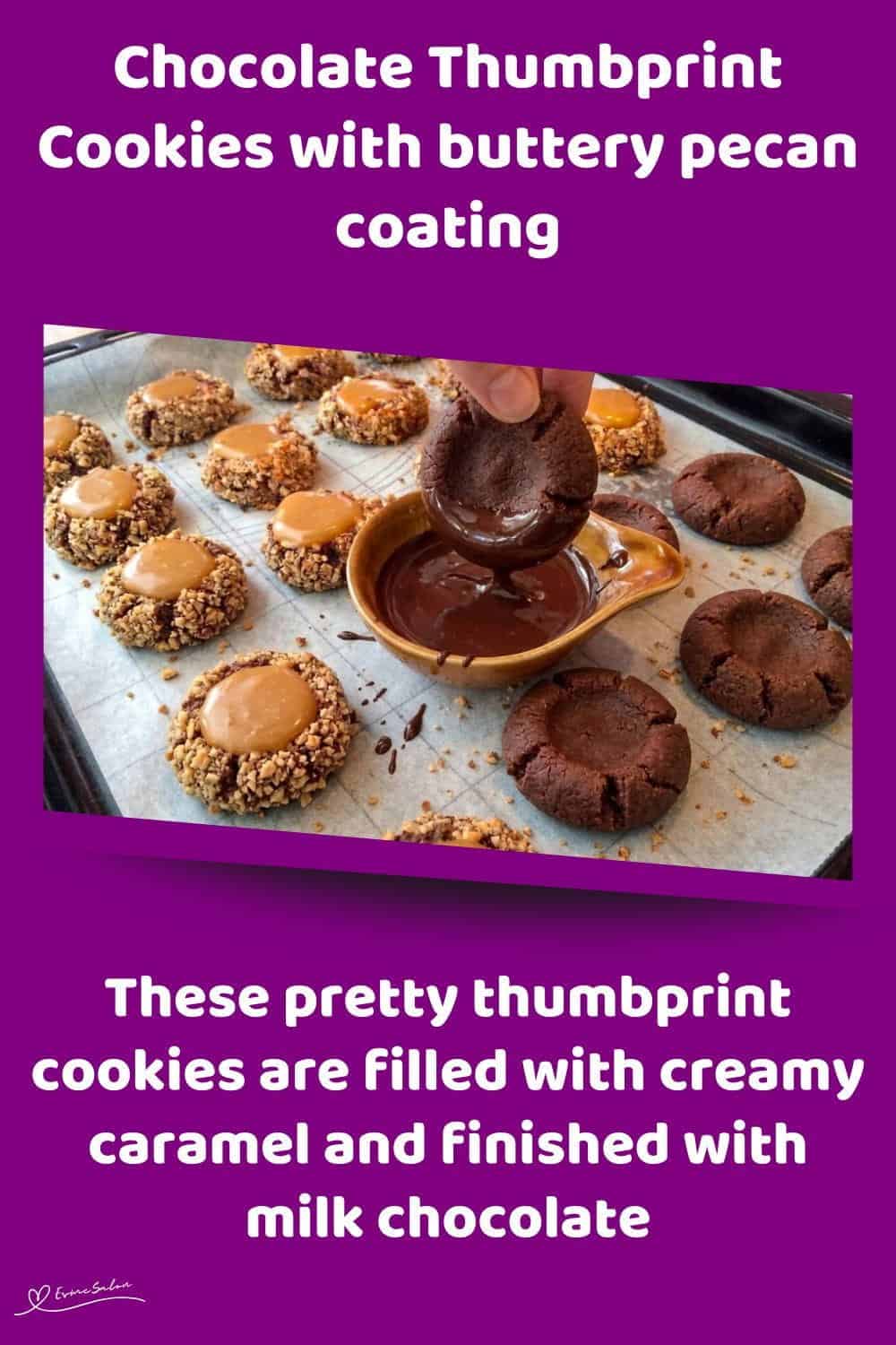 An image of a tray filled with Chocolate Thumbprint Cookies coated with pecan nuts and a caramel centre
