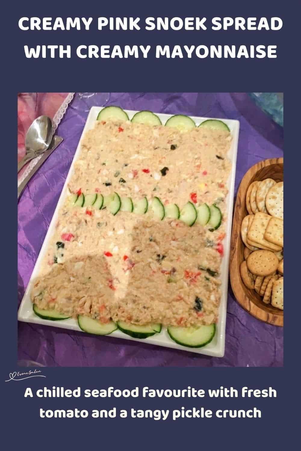 An image of a platter with a Pink Creamy Snoek Spread with dill cucumbers, finely chopped hard-boiled egg and chopped tomato