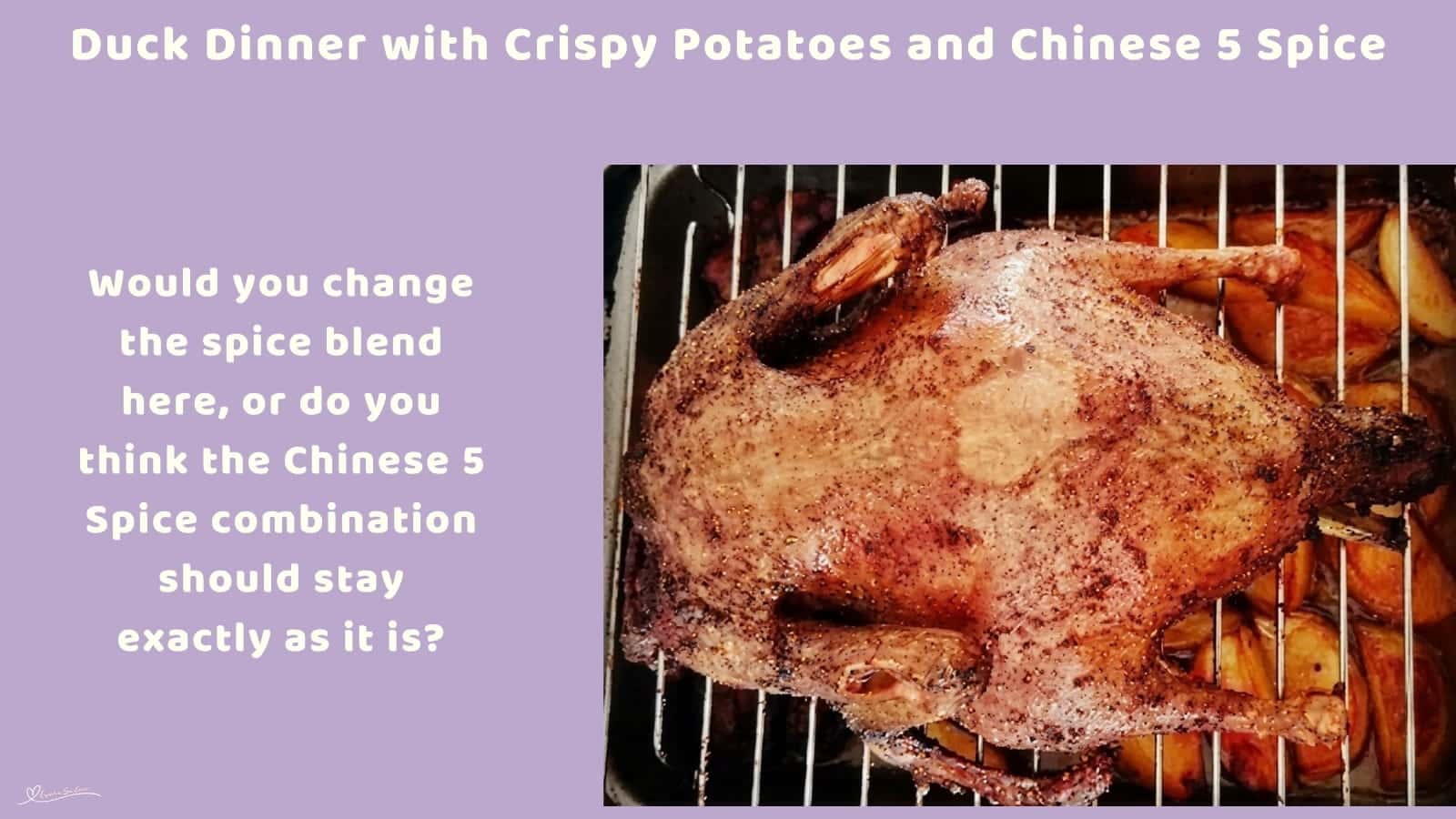 An image of a Duck roasting with potatoes underneath the rack