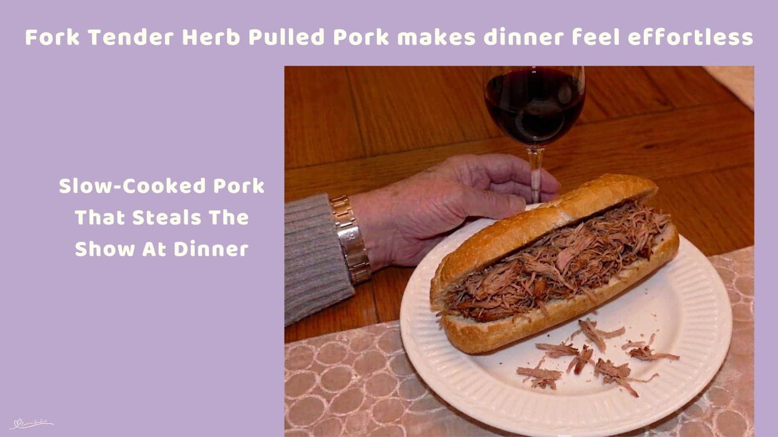 An image of slow-cooked Herb Pulled Pork on a bread roll with a glass of red wine in the background