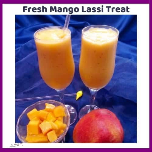 An image of 2 tall glasses of mango lassi with plain yogurt and green cardamom powder