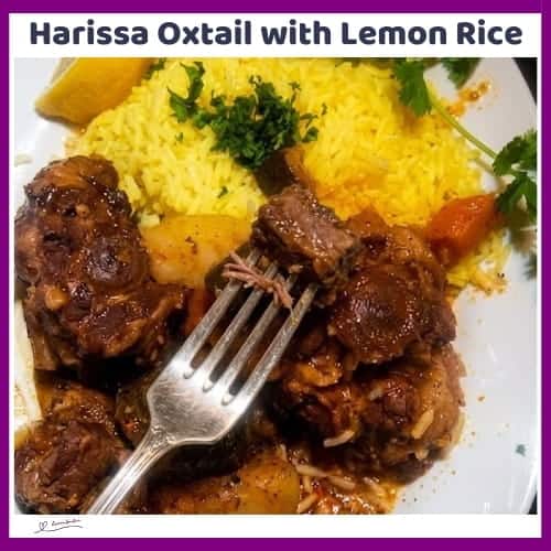 An image of a plate filled with Harissa Oxtail with Lemon Basmati Rice, toasted whole spices, tomatoes and Moroccan seasoning