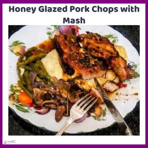 An image of a plate with Honey Glazed Pork Chops with creamy potatoes, Garlic Butter Green Beans and Mushrooms and Red Onions