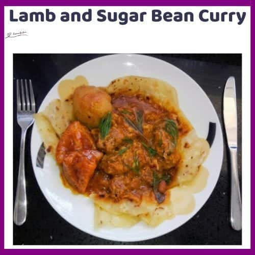 An image of a plate with Lamb and Sugar Bean Curry combined in one meal with naan