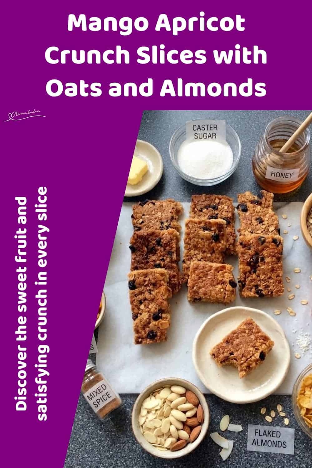 An image of a dish of a tray of Mango Apricot Crunch Slices with almonds, coconut, apricots and mango