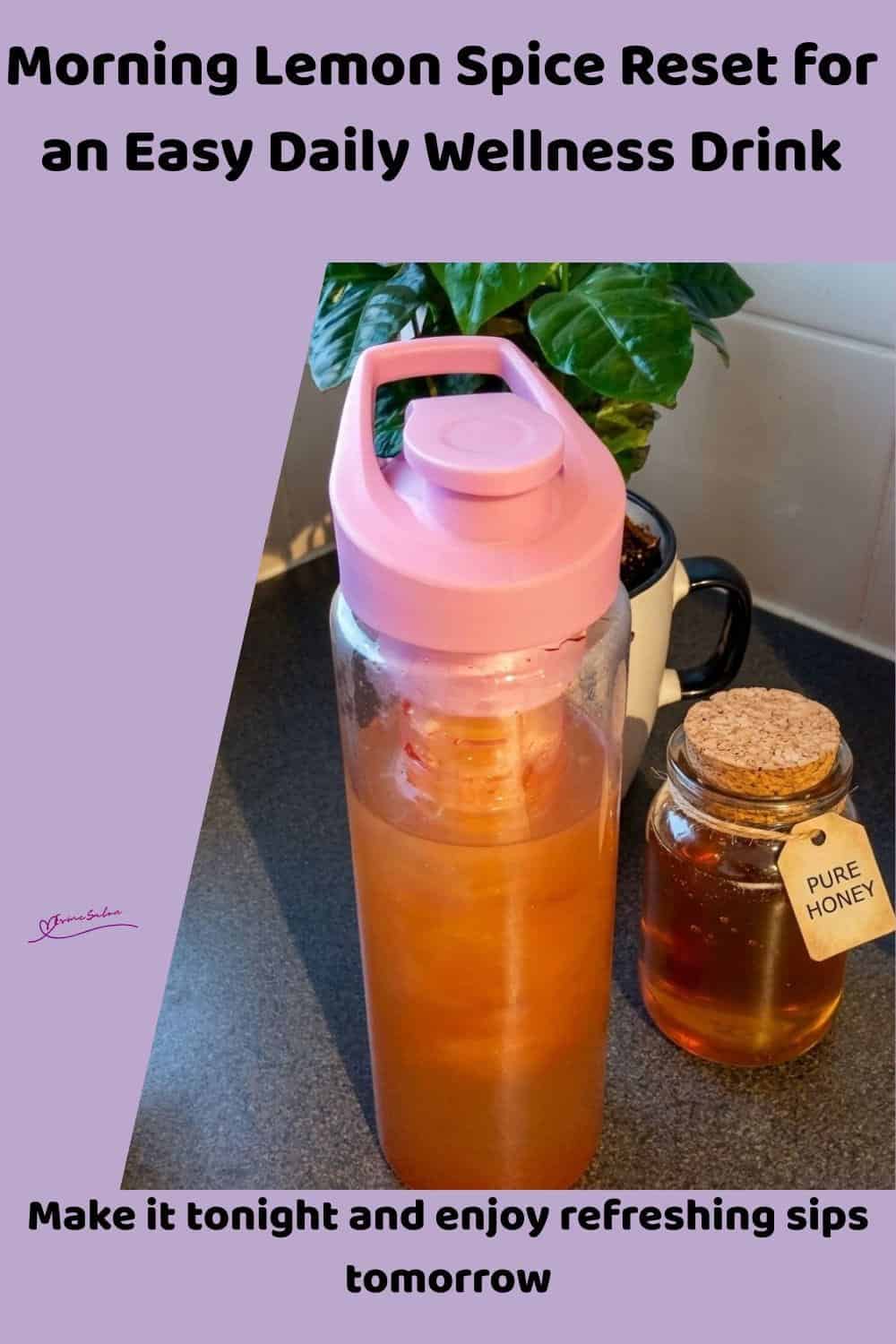 An image of a travel mug with Morning Lemon Spice Reset made with fresh lemon, honey, cinnamon, and cayenne pepper
