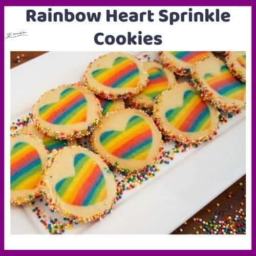 An image of a plate of Butter Rainbow Heart Sprinkle Cookies