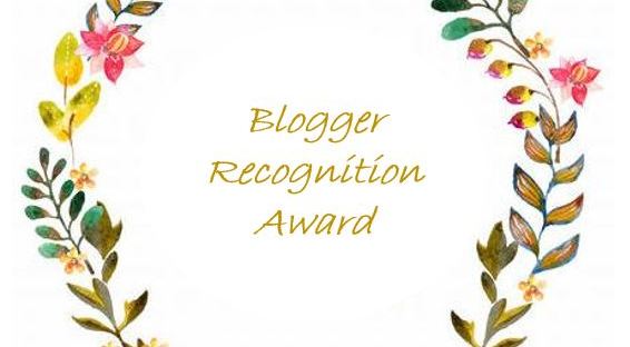 Green, yellow and pink flowers on both sides with overlay ov Blogger Recognition Award