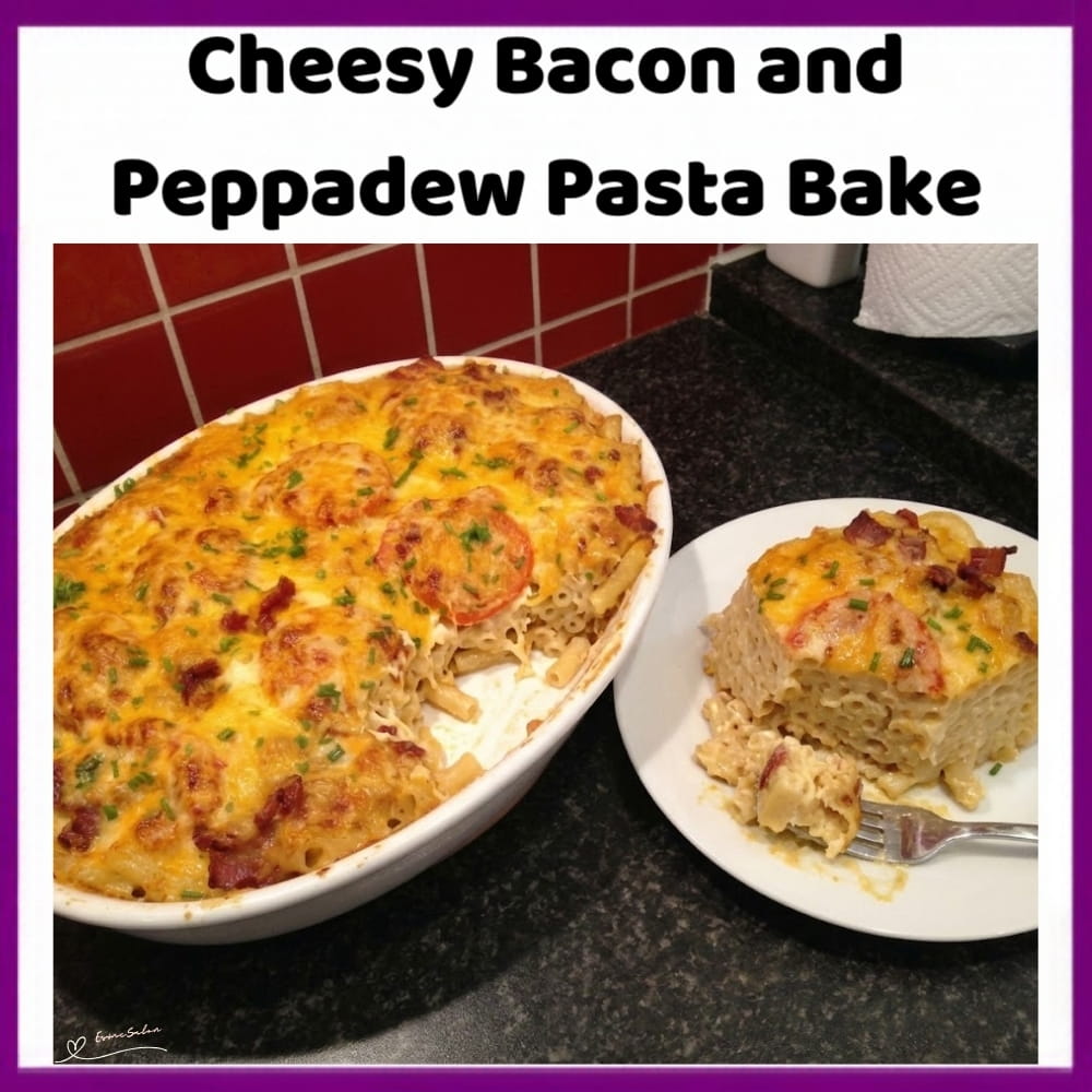 An image of a dish of Cheesy Bacon and Peppadew Pasta Bake with Extra Cheddar and slices of tomato