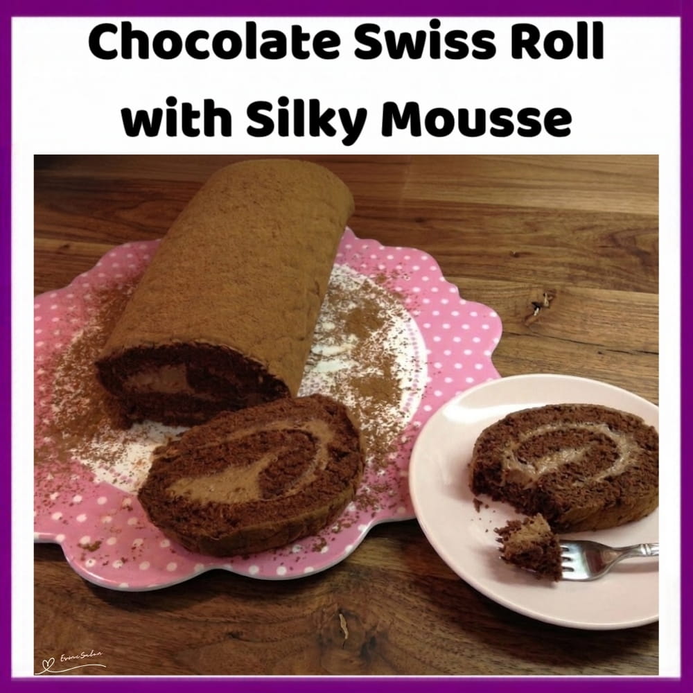 An image of a plate with a Chocolate Swiss Roll, a soft chocolate exterior and a smooth, fluffy Chocolate Mousse filling hidden inside, with a light dusting of cocoa as a finishing touch