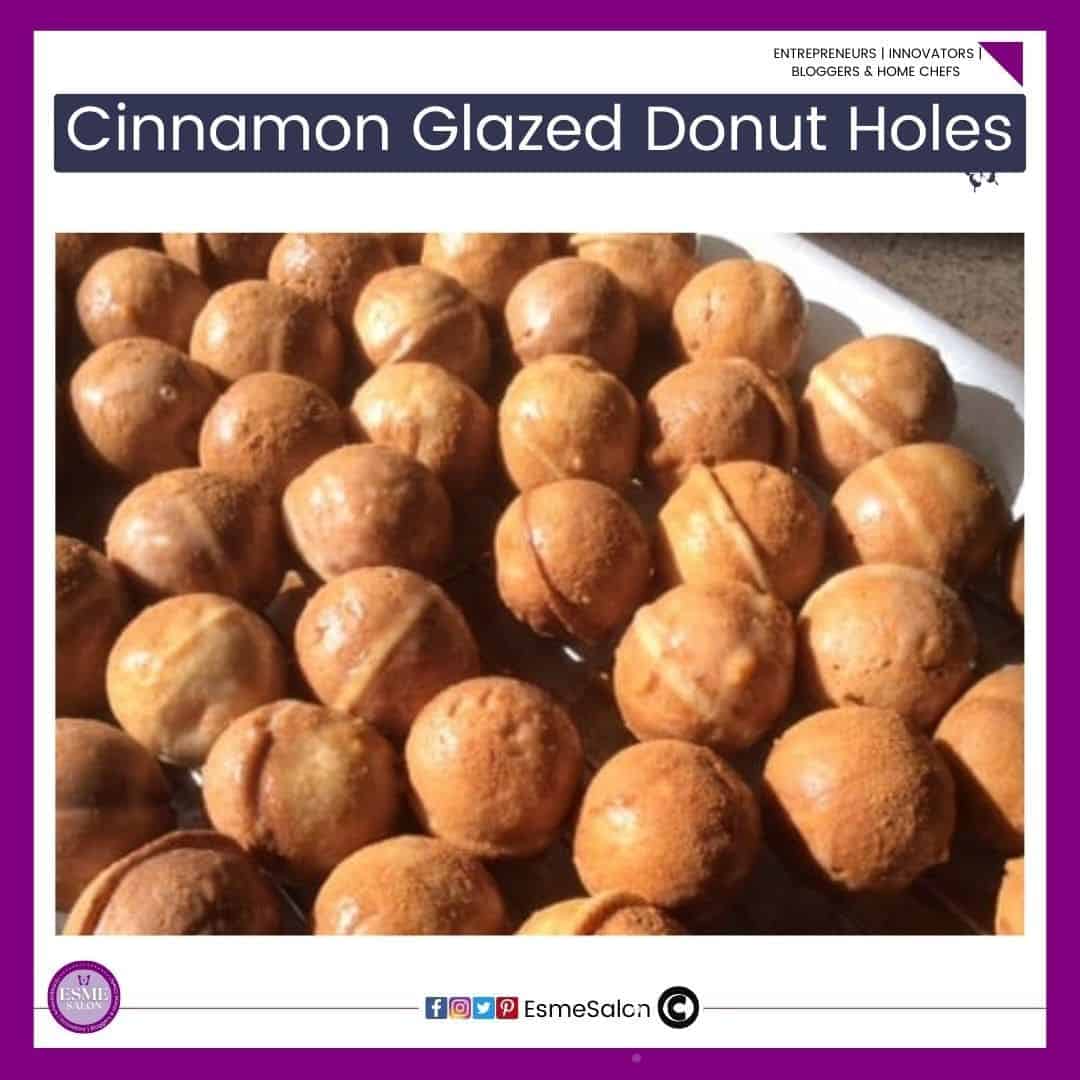 an image of a baking tray filled with Cinnamon Glazed Donut Holes