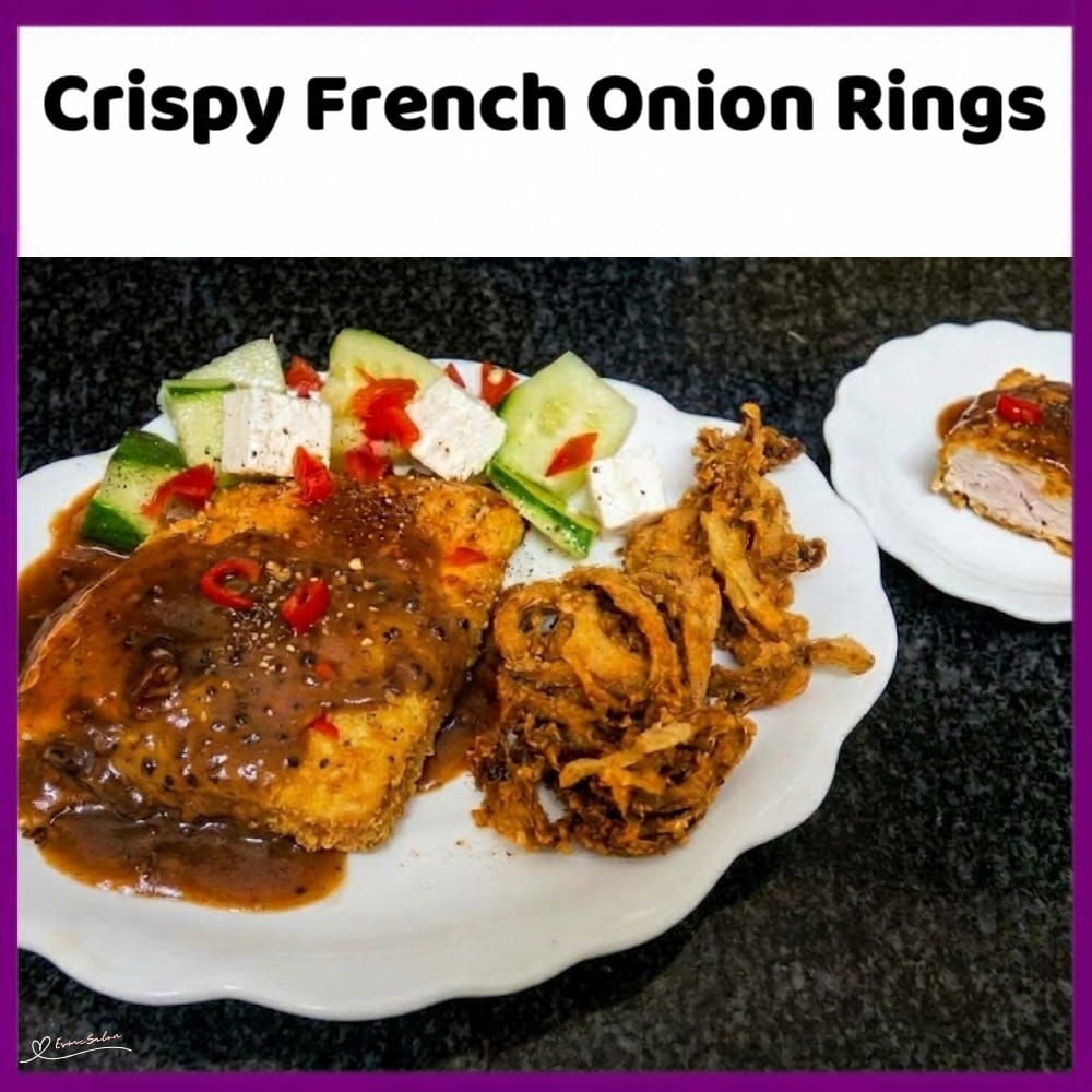 An image of a main dish with a plate of Crispy French Onion Rings with a coating of garlic, paprika and black pepper