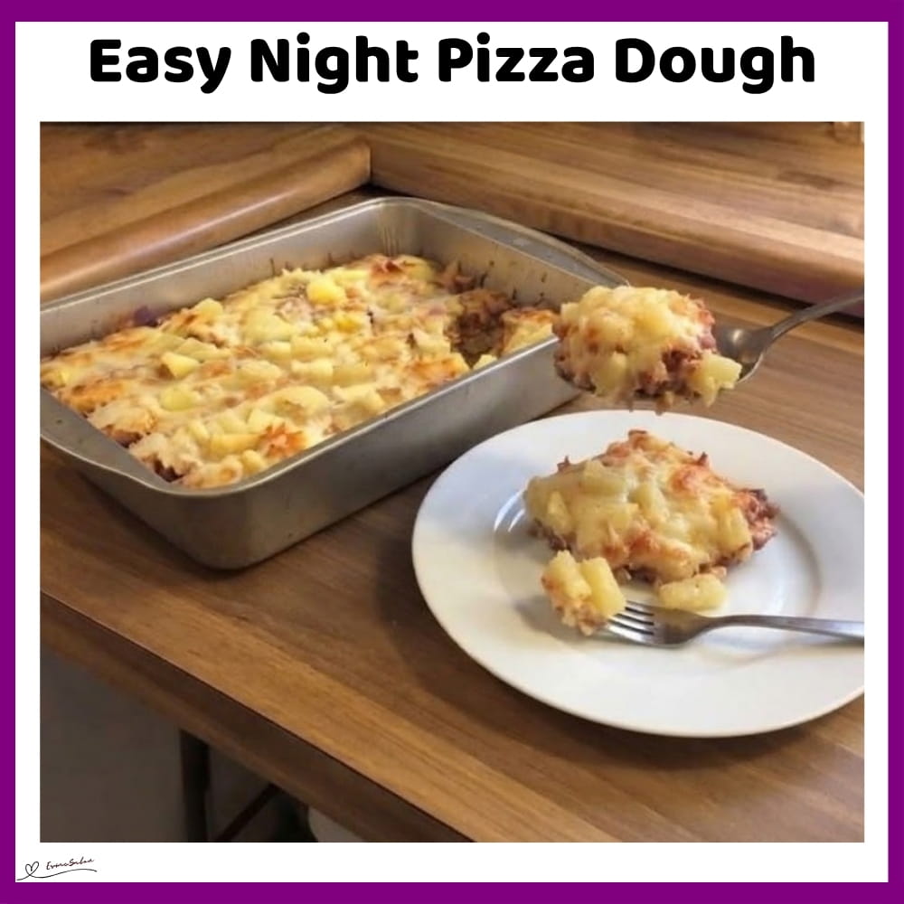 An image of a baking tray with pizza dough, with garlic and Italian seasoning in the dough