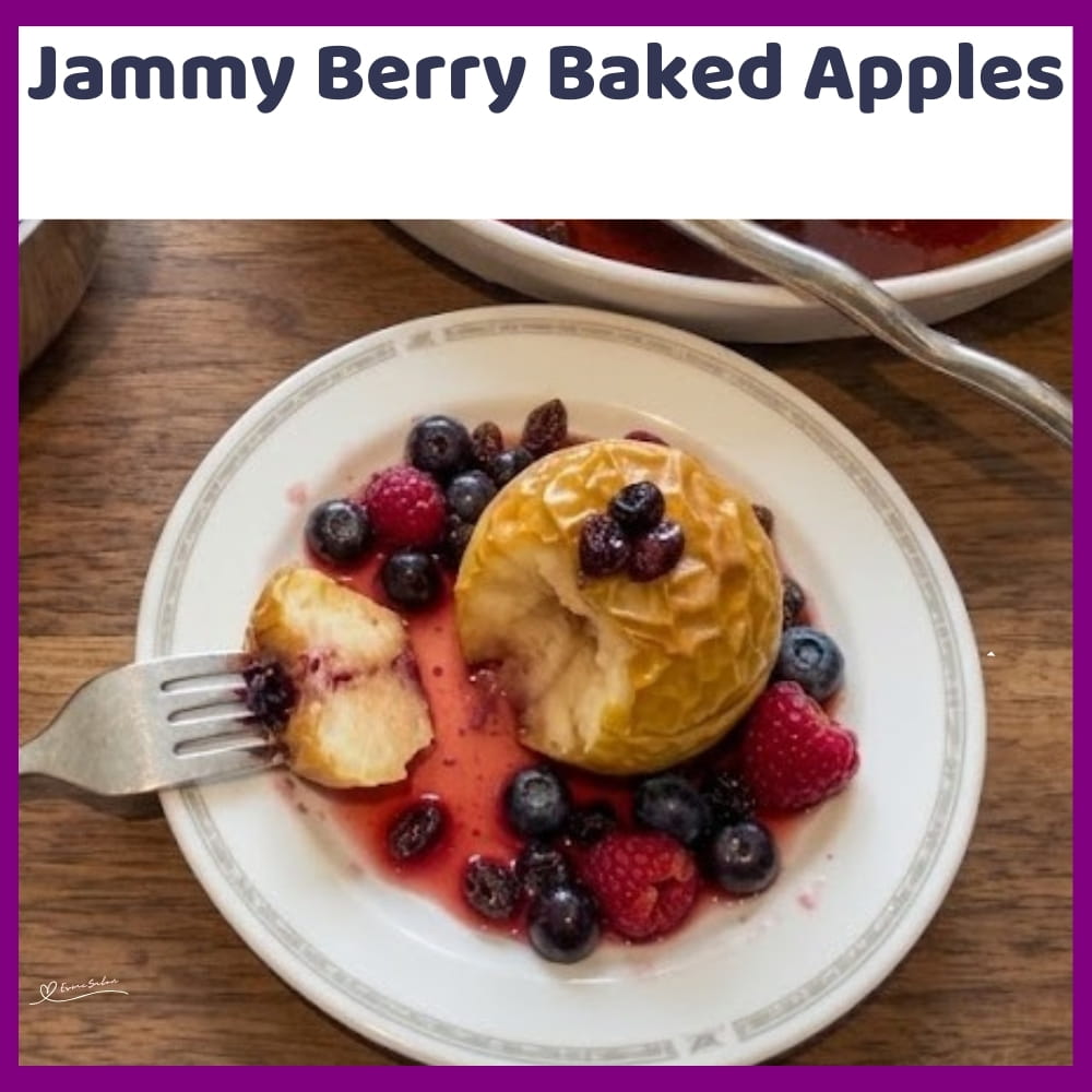 An image of a plate of Berry Baked Apples and a dish of tangy Berries on the side