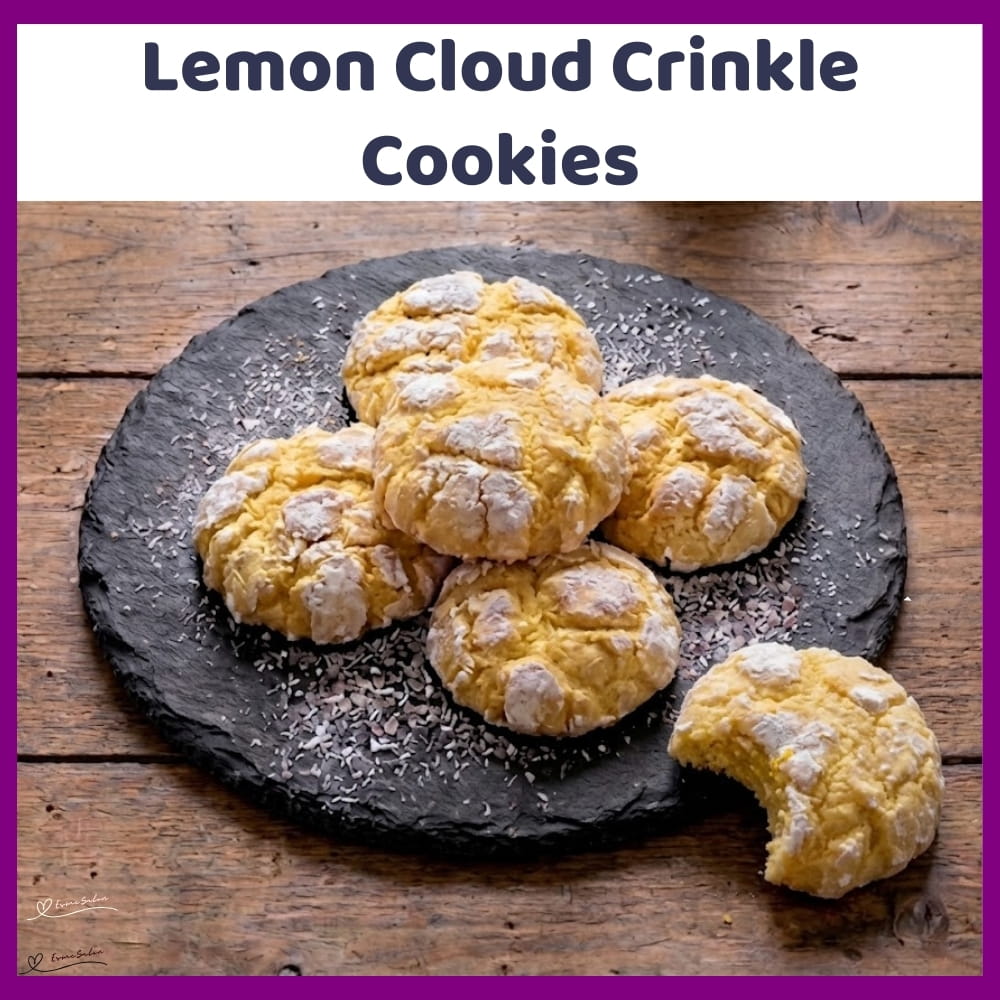 An image of a platter of Lemon Cloud Crinkle Cookies with confectioners' sugar tops