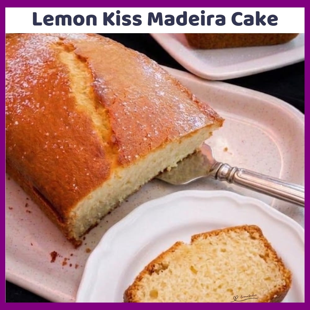 An image of a plate with a Madeira cake with lemon rind and light icing sugar dusting