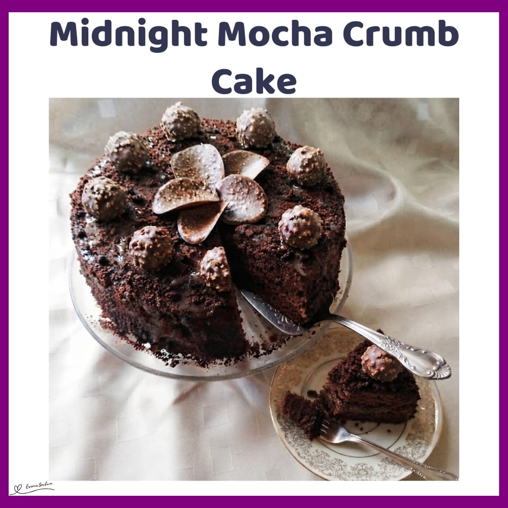 An image of a round Mocha Crumb Cake with rich chocolate custard and crumb coating