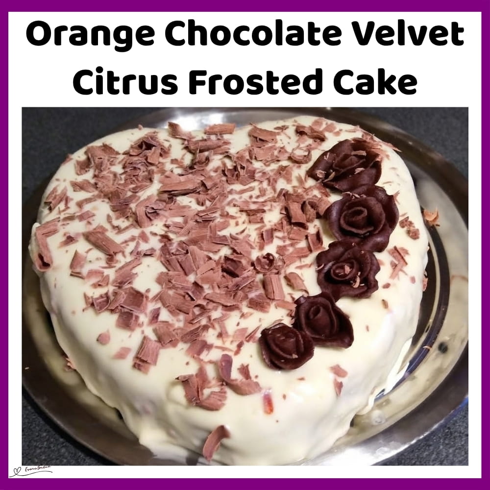 An image of a heart-shaped orange chocolate velvet citrus frosted cake