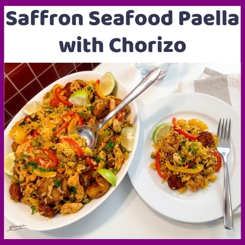 An image of a plate of Seafood Paella and Chorizo with prawns, mussels, chicken, smoky chorizo, peppers and saffron rice