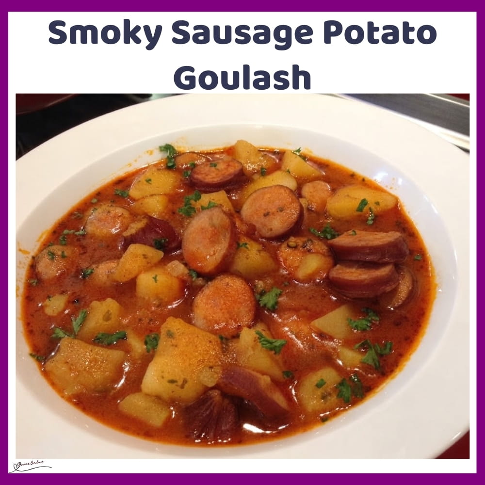 An image of a plate with Sausage Potato Goulash, with smoked Russian sausage and onions
