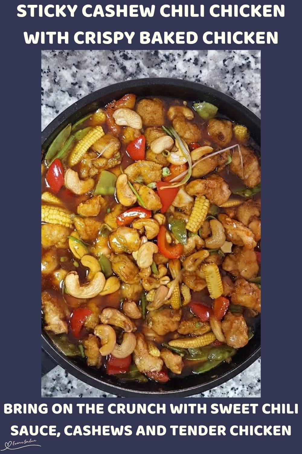 An image of a skillet with Sticky Cashew Chili Chicken Cubes with red peppers, cashew nuts, and Baby corn