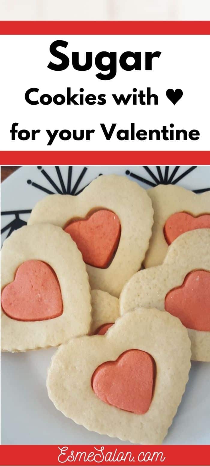 Heart shaped sugar cookies with a red heart in the middle