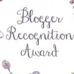 Lilac and green flowers on the left and right with overlay of Blogger Recognition Award