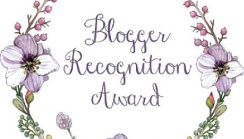 Lilac and green flowers on the left and right with overlay of Blogger Recognition Award
