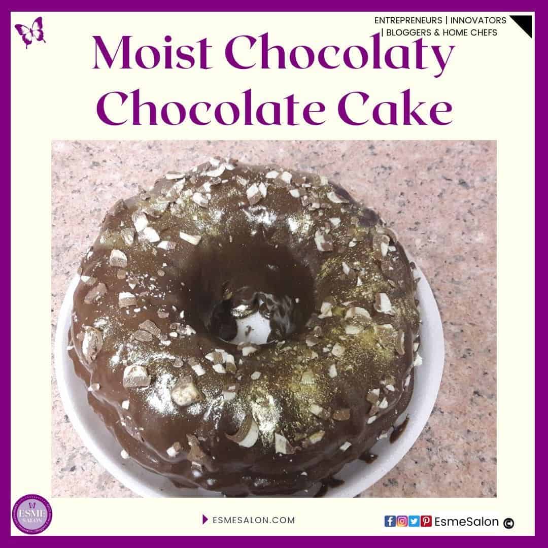 an image of a round Bundt Moist Chocolaty Chocolate Cake with shredded top deck chocolate