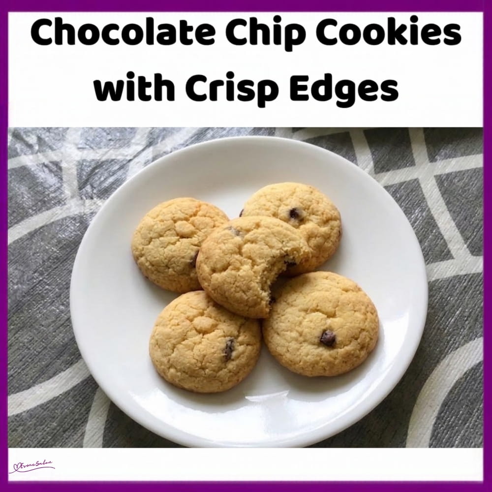 An image of a plate with Chocolate Chip Cookies with Crisp Edges and soft centres, combining brown sugar, vanilla and chocolate chips