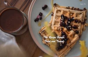 Choc Chip Blueberry Vegan Waffles with fresh blueberries on top