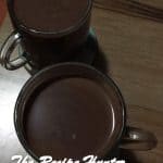 Two brown mugs filled with Dark Hot Chocolate