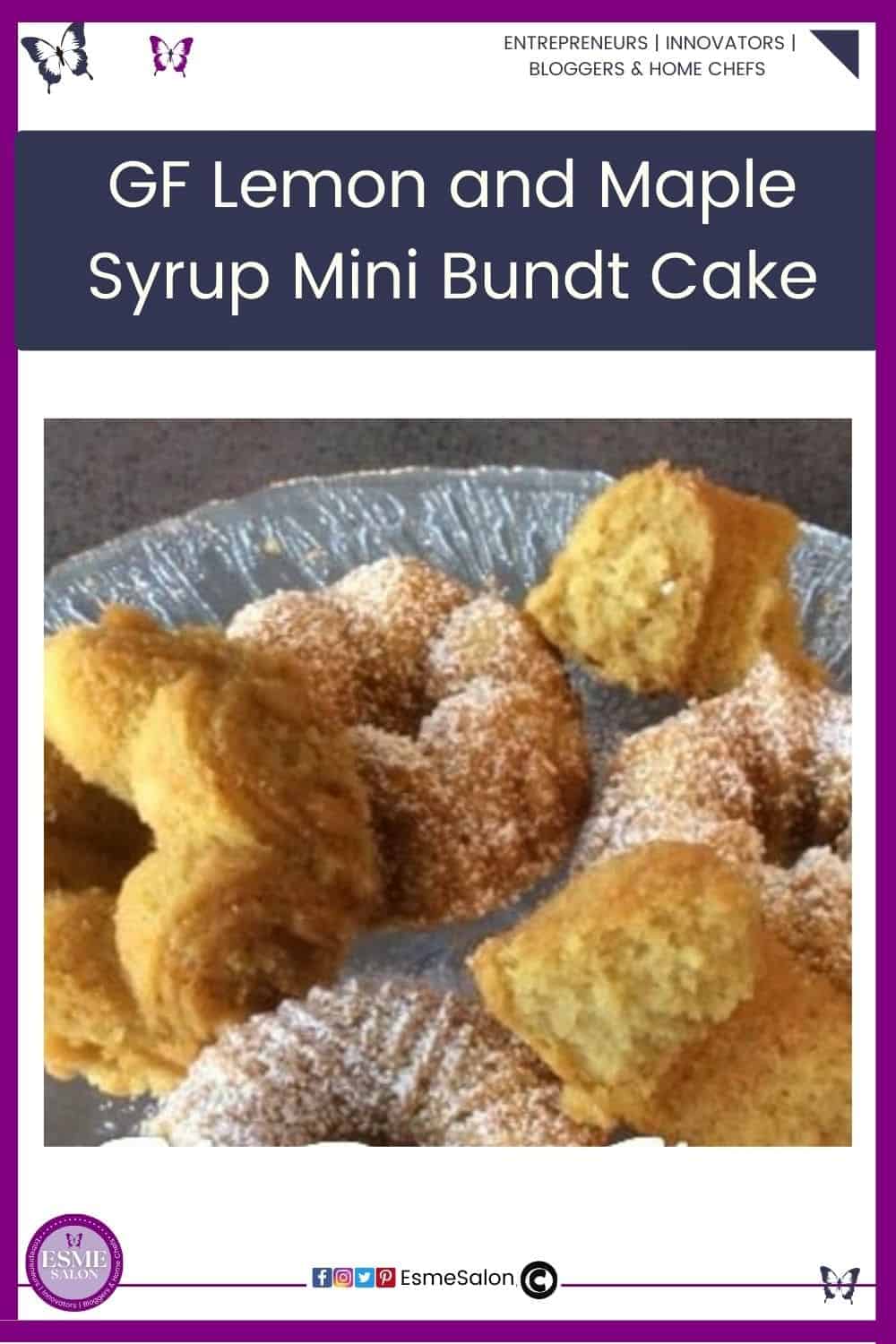 an image of a glass cake stand with Gluten Free Lemon and Maple Syrup Mini Bundt Cake some dusted with confectioners sugar