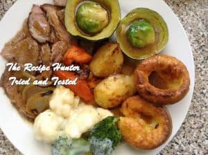 an image of a plated meal of Roast Beef with Yorkshire Pudding