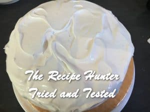 A Lemon Curd Cake with Meringue Icing only on the top