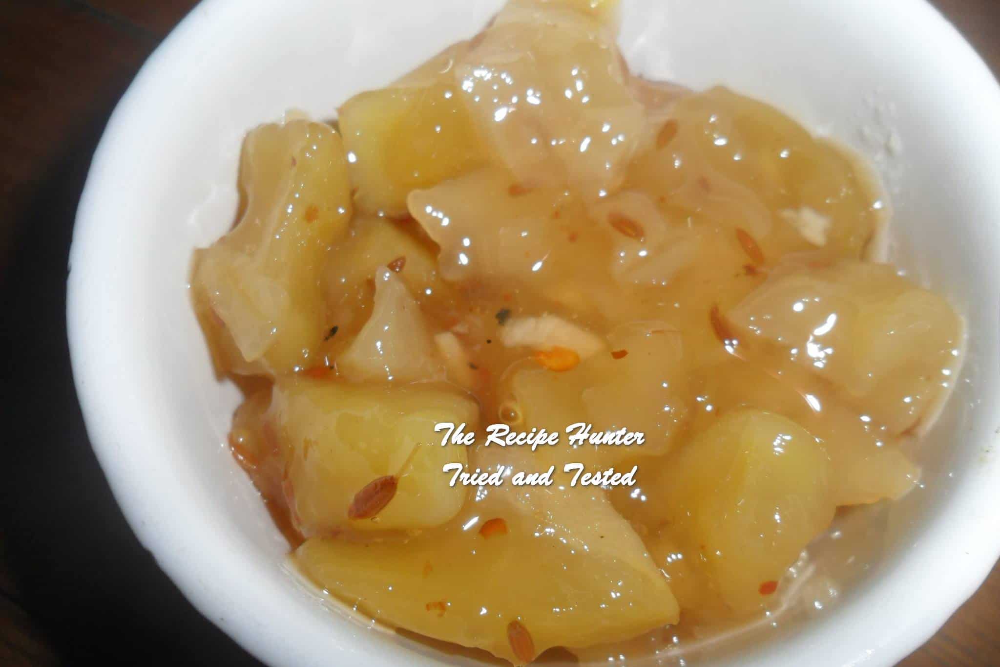 Homemade Mango Chutney in a white dish made with Green under-ripe Mangoes