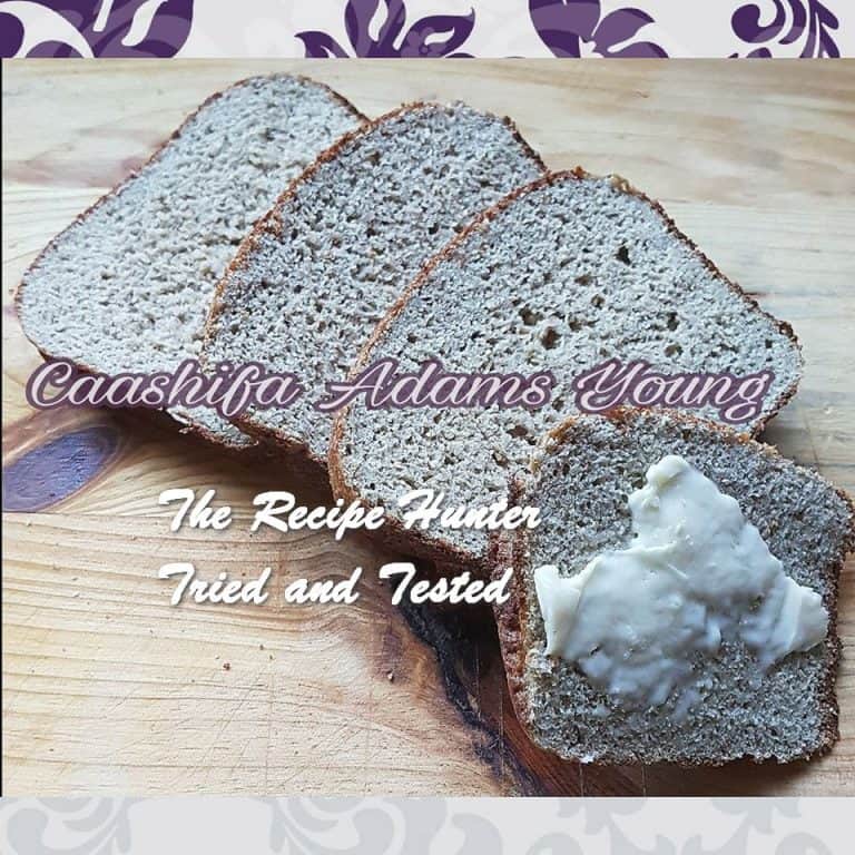 Slices of Low Carb Sunflower Yeast Bread with butter spread on the front one