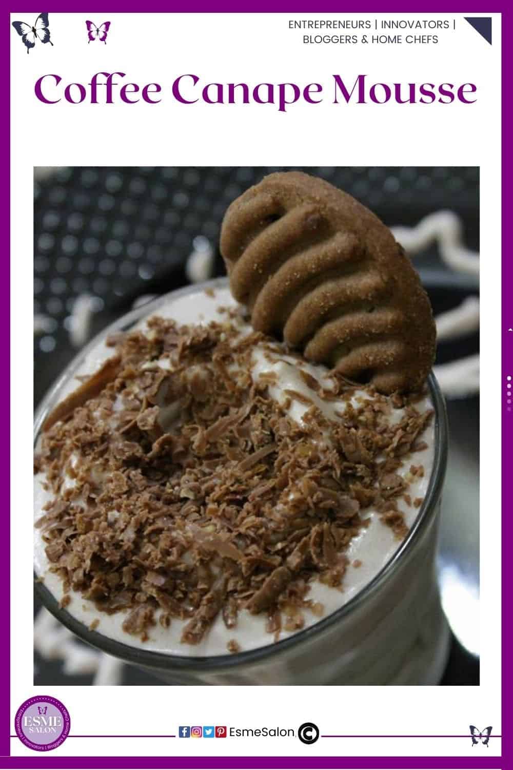 an image of a glass mug filled with Coffee Canape Mousse and topped with chocolate shavings and a brown cookie