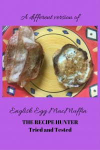 English Egg McMuffin with egg in the center of the muffin with bacon on the side