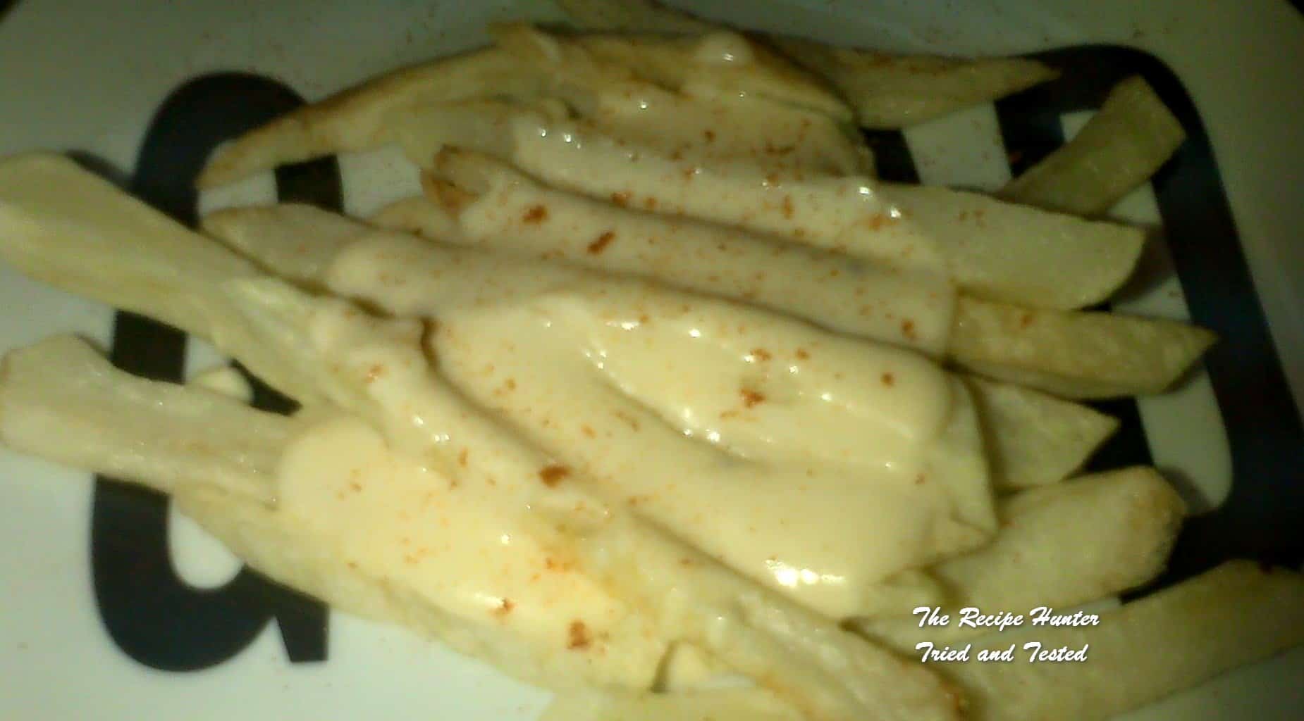 Melenie's French Fries Smothered in Cheese Sauce