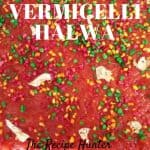 Red colored Vermicelli Halwa and topped with colored almonds