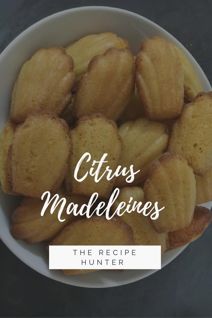 Small Citrus Madeleines cookies in a white bowl with overlay Citrus Madeleines