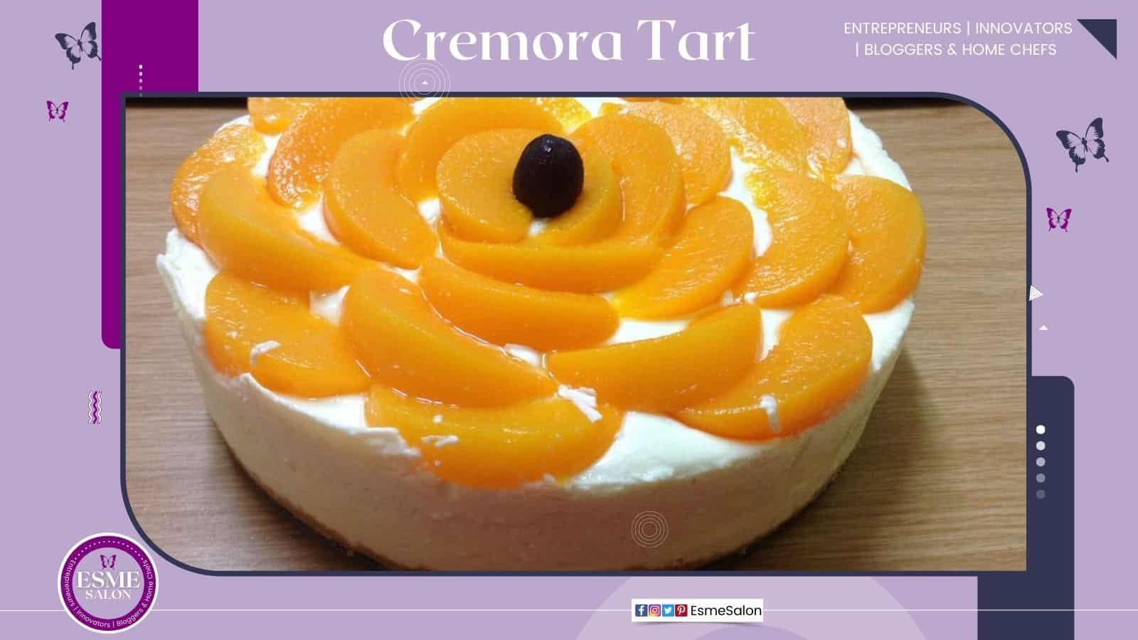 an image of a white Cremora Tart with slices of peaches