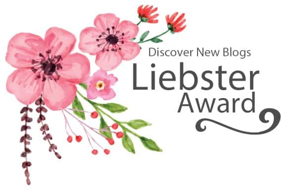 Pink flowers with berries on white background with black wording Liebster award