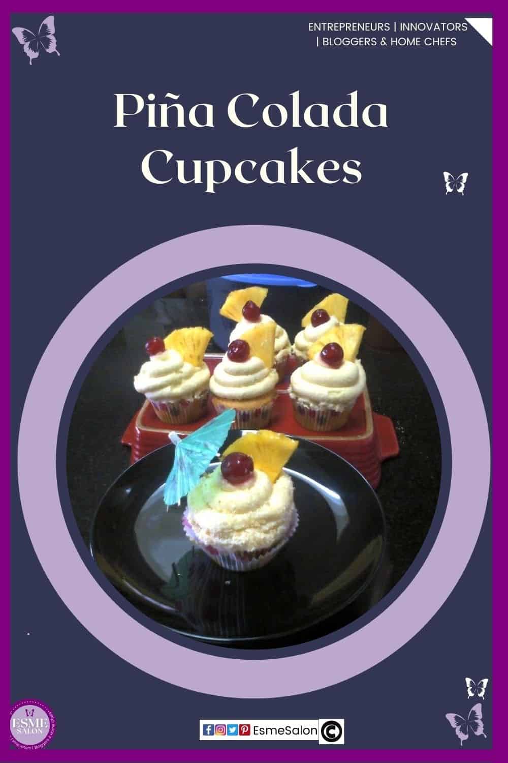 an image of 6 Piña Colada Cupcakes with a red cherry, piece of pineapple and one with a blue paper umbrella