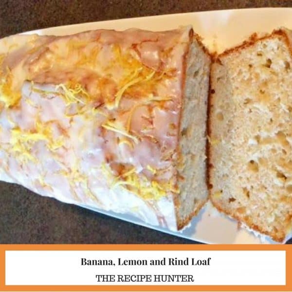 Banana loaf with lemon rind on the top and a slice on the side